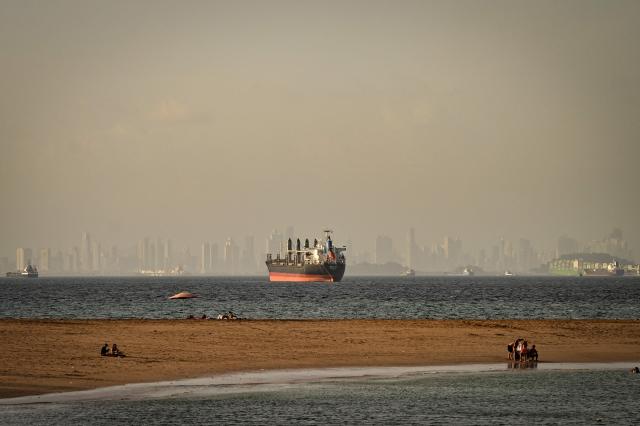 A cargo ship waits before entering the Panama Canal in Panama City on August 8,2026. (Photo by MARTIN BERNETTI / AFP)