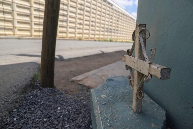 A cross is seen near the vehicular bridge in the community of Pozo de Gamboa, in the municipality of Panuco, Zacatecas state, Mexico, on August 7, 2026, where five men were found dead. A community in Mexico woke up one day in July to find five bodies hanging from a bridge. It was a reminder that the violence had never gone away. The bodies were found in Pozo de Gamboa, a community of just 5,000 residents in the state of Zacatecas, which connects the central part of the country with the north and west and is home to key drug trafficking routes. (Photo by Jesse Mirales / AFP)
