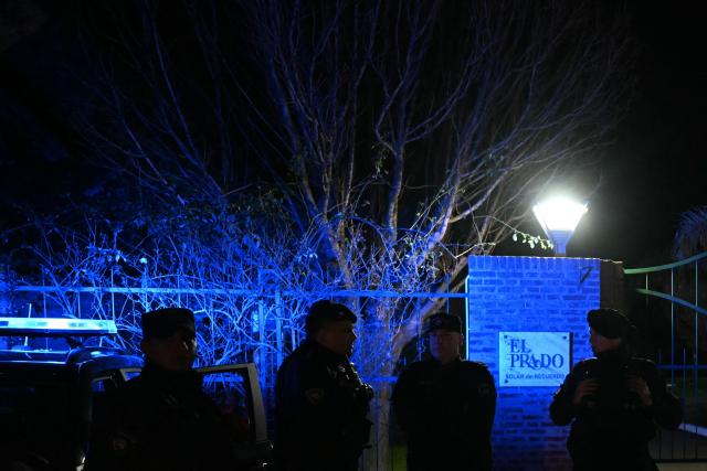 Argentine police officers stand guard at the entrance to El Prado cemetery during the wake of Jorge Messi, the father and agent of Lionel Messi, on the outskirts of Rosario, Santa Fe province, Argentina, on August 8, 2026. Jorge Messi, the father and agent of Lionel Messi, has died aged 68, the eight-time Ballon d'Or winner's childhood club Newell's Old Boys announced on August 8, 2026. (Photo by Luis ROBAYO / AFP)