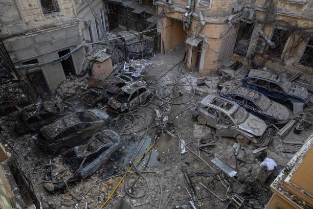 This photograph shows burned cars at the site of a Russian air attack in Odesa on August 9, 2026, amid the Russian invasion in Ukraine. (Photo by Oleksandr GIMANOV / AFP)