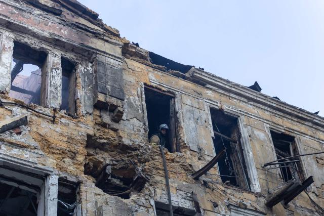 A Ukrainian rescuer works in a building at the site of a Russian air attack in Odesa on August 9, 2026, amid the Russian invasion in Ukraine. (Photo by Oleksandr GIMANOV / AFP)
