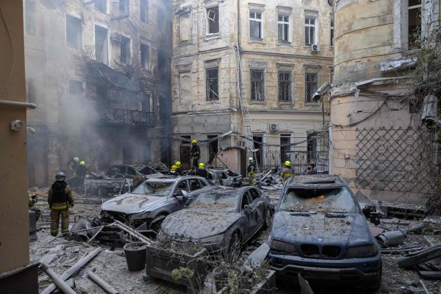 Ukrainian rescuers work in the courtyard of a damaged building at the site of a Russian air attack in Odesa on August 9, 2026, amid the Russian invasion in Ukraine. (Photo by Oleksandr GIMANOV / AFP)