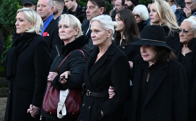 (FILES) (From L) Jean-Marie Le Pen's daughters Marine Le Pen, Yann Le Pen, Marie-Caroline Le Pen and Jean-Marie Le Pen second's wife Jany Le Pen, followed by Marion Marechal (2nd R, up), walk towards the cemetery during Jean-Marie Le Pen's burial in his hometown of La Trinite-sur-Mer on January 11, 2025. Behind the scenes, the French far-right party Rassemblement National (RN) candidate for the presidential election relies above all on her family and her inner circle: more than just a team, its a clan. (Photo by Sebastien Salom-Gomis / AFP)