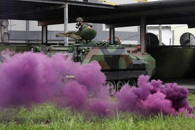 Taiwanese soldiers conduct a chemical contamination rescue drill as part of the annual Han Kuang military exercise in Hualien on August 9, 2026. (Photo by Chiang Ying-ying / POOL / AFP)