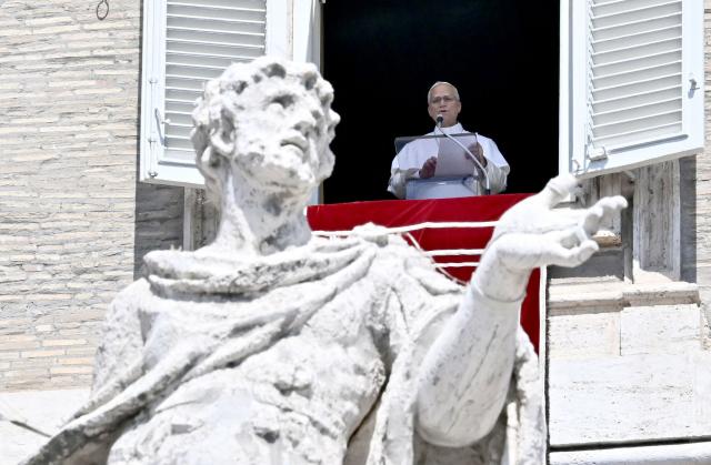Pope Leo XIV speaks during his Angelus prayer from a balcony overlooking St. Peter's Square at the Vatican, on August 9, 2026. (Photo by Filippo MONTEFORTE / AFP)
