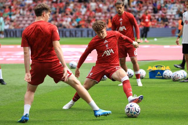 Liverpool's Spanish midfielder #23 Víctor Muñoz (C) warms up ahead of the pre-seaon friendly football match between Liverpool and Monaco at Anfield in Liverpool, north west England on August 9, 2026. (Photo by Darren Staples / AFP)