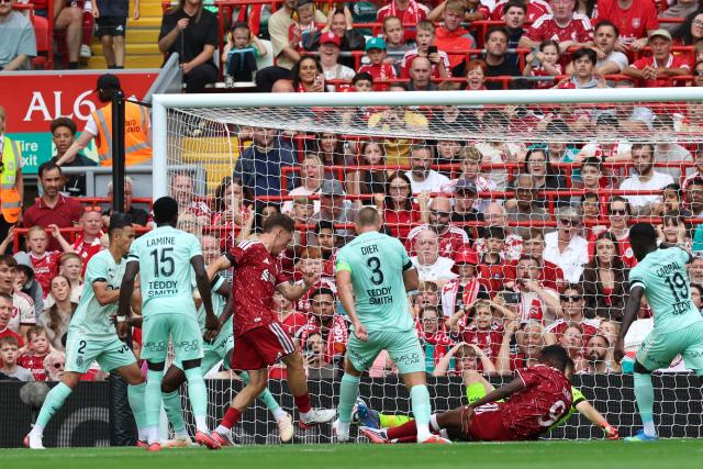 Liverpool's German midfielder #07 Florian Wirtz (3L) scores their second goal during the pre-season friendly football match between Liverpool and Monaco at Anfield in Liverpool, north west England on August 9, 2026. (Photo by Darren Staples / AFP)