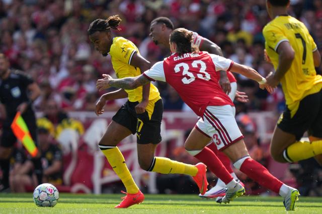Dortmund's British-Nigerian midfielder #17 Carney Chukwuemeka runs with the ball during the English Premier League football match between Arsenal and Borussia Dortmund at the Emirates Stadium in London on August 9, 2026. (Photo by CARLOS JASSO / AFP)