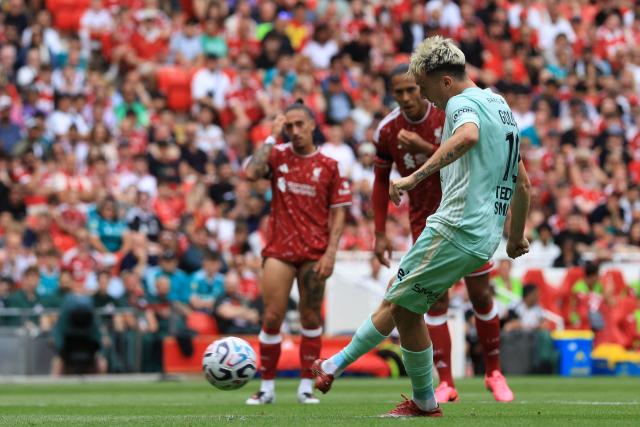 Monaco's Russian midfielder #10 Aleksandr Golovin scores their first goal from the penalty spot during the pre-season friendly football match between Liverpool and Monaco at Anfield in Liverpool, north west England on August 9, 2026. (Photo by Darren Staples / AFP)