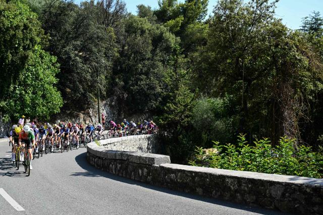The pack rides in the Col d'Eze during the 9th and final stage of the fifth edition of the Women's Tour de France cycling race, 99.2 km from Nice to Nice, southeastern France on August 9, 2026. (Photo by NICOLAS TUCAT / AFP)