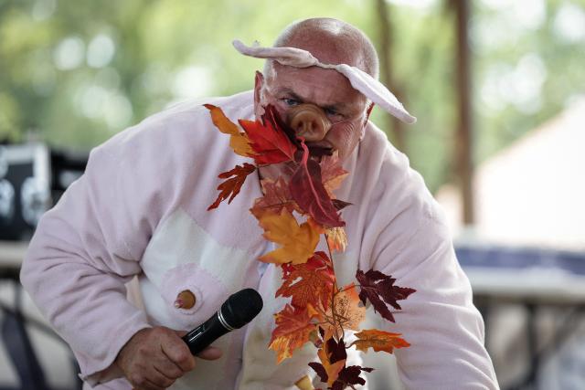 Noel Jamet, 10-time champion in the French pig-squealing championship, performs on stage at the 43rd edition of the Pig Festival, in Trie-sur-Baïse, south-western France, on August 9, 2026. (Photo by Valentine CHAPUIS / AFP)
