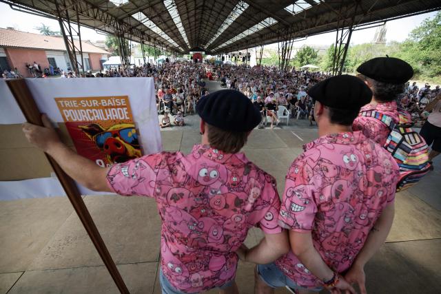 Participants in the French pig-squealing championship perform on stage at the 43rd edition of the Pig Festival, in Trie-sur-Baïse, south-western France, on August 9, 2026. (Photo by Valentine CHAPUIS / AFP)