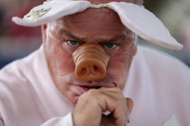Noel Jamet, 10-time champion in the French pig-squealing championship, looks on during the 43rd edition of the Pig Festival, in Trie-sur-Baïse, south-western France, on August 9, 2026. (Photo by Valentine CHAPUIS / AFP)