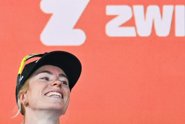FDJ-SUEZ's Dutch rider Demi Vollering celebrates on the podium after winning the 9th and final stage of the fifth edition of the Women's Tour de France cycling race, 99.2 km from Nice to Nice, southeastern France on August 9, 2026. (Photo by NICOLAS TUCAT / AFP)