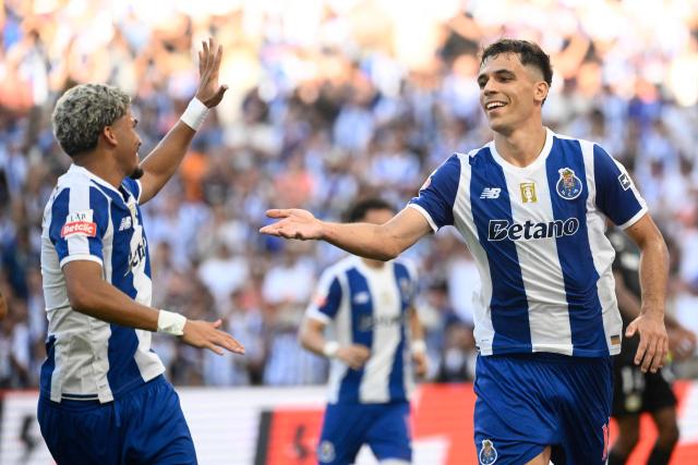 FC Porto's Spanish midfielder #10 Gabriel Veiga (R) celebrates scoring his team's second goal, with FC Porto's Brazilian forward #07 William Gomes, during the Portuguese League football match between FC Porto and FC Alverca at Dragao stadium in Porto on August 8, 2026. (Photo by Miguel RIOPA / AFP)