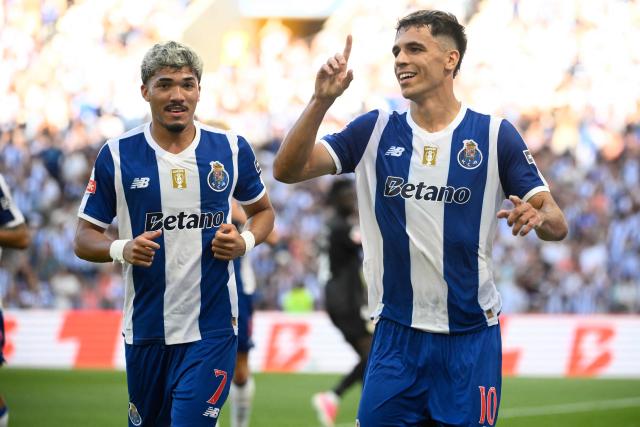 FC Porto's Spanish midfielder #10 Gabriel Veiga (R) celebrates scoring his team's second goal during the Portuguese League football match between FC Porto and FC Alverca at Dragao stadium in Porto on August 8, 2026. (Photo by Miguel RIOPA / AFP)