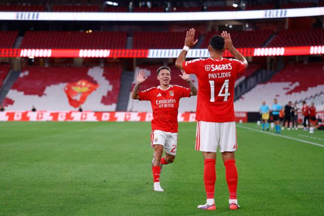 Benfica's Greek forward #14 Vangelis Pavlidis celebrates with Benfica's Argentine forward #25 Gianluca Prestianni after scoring the opening goal during the Portuguese League football match between SL Benfica and Academico de Viseu FC at Estadio da Luz in Lisbon on August 9, 2026. (Photo by FILIPE AMORIM / AFP)