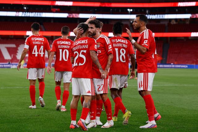 Benfica's Argentine forward #25 Gianluca Prestianni is congratulated by Benfica's Portuguese forward #27 Rafa Silva for scoring his team's second goal during the Portuguese League football match between SL Benfica and Academico de Viseu FC at Estadio da Luz in Lisbon on August 9, 2026. (Photo by FILIPE AMORIM / AFP)