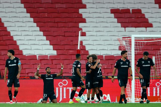 Academico de Viseu's Brazilian forward #33 Andre Clovis celebrates scoring his team's second goal during the Portuguese League football match between SL Benfica and Academico de Viseu FC at Estadio da Luz in Lisbon on August 9, 2026. (Photo by FILIPE AMORIM / AFP)