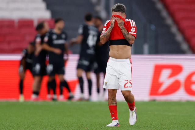 Benfica's Argentine forward #25 Gianluca Prestianni reacts to Academico's second goal during the Portuguese League football match between SL Benfica and Academico de Viseu FC at Estadio da Luz in Lisbon on August 9, 2026. (Photo by FILIPE AMORIM / AFP)