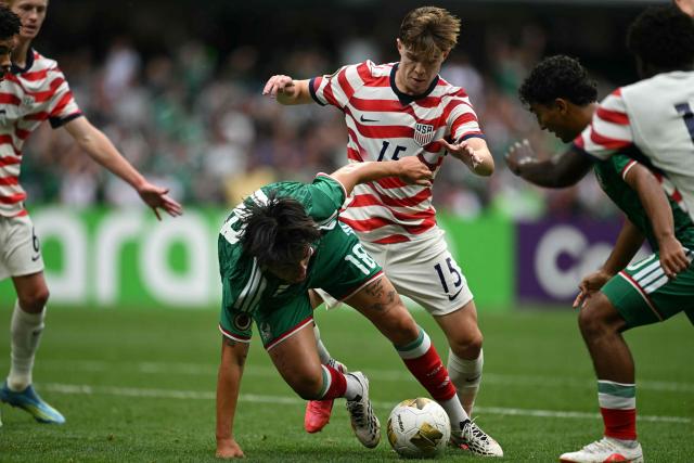 Mexico's midfielder #18 Samir Inda and US midfielder #15 Cooper Sanchez fight for the ball during the Concacaf U-20 Championship final football match between United States and Mexico at the Banorte Stadium in Mexico City on August 9, 2026. (Photo by Yuri CORTEZ / AFP)