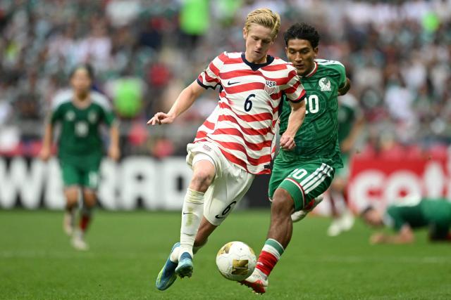US midfielder #06 Colin Guske and Mexico's defender #20 Diego Ramirez fight for the ball during the Concacaf U-20 Championship final football match between United States and Mexico at the Banorte Stadium in Mexico City on August 9, 2026. (Photo by Yuri CORTEZ / AFP)