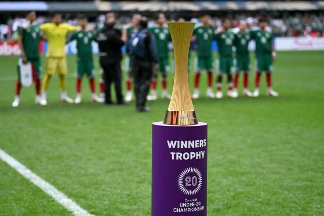 The Concacaf U-20 Championship trophy is displayed on the pitch ahead of the final football match between United States and Mexico at the Banorte Stadium in Mexico City on August 9, 2026. (Photo by YURI CORTEZ / AFP)