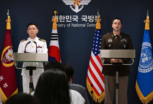 Public Affairs Director of South Korea's Joint Chiefs of Staff Col. Jang Do-young (L) and Public Affairs Director of the United Nations Command, Combined Forces Command, and United States Forces Korea (USFK) Col. Ryan Donaldn (R) attend a press briefing for the Ulchi Freedom Shield 2026 exercise at the Defence Ministry in Seoul on August 10, 2026. (Photo by SONG Kyung-Seok / POOL / AFP)