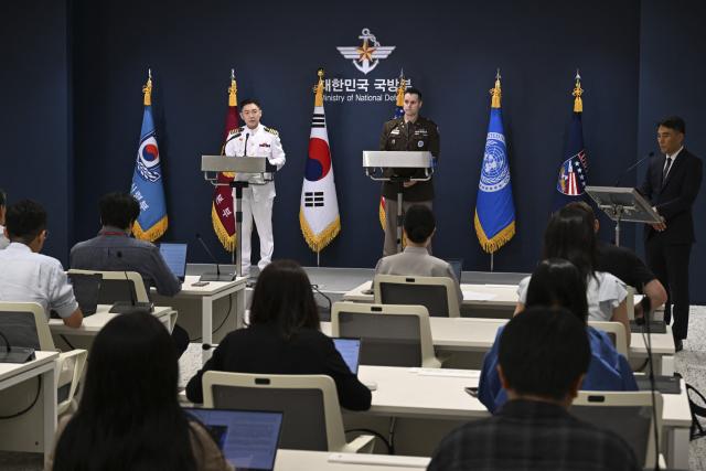Public Affairs Director of South Korea's Joint Chiefs of Staff Col. Jang Do-young (L) and Public Affairs Director of the United Nations Command, Combined Forces Command, and United States Forces Korea (USFK) Col. Ryan Donaldn (R) attend a press briefing for the Ulchi Freedom Shield 2026 exercise at the Defence Ministry in Seoul on August 10, 2026. (Photo by SONG Kyung-Seok / POOL / AFP)