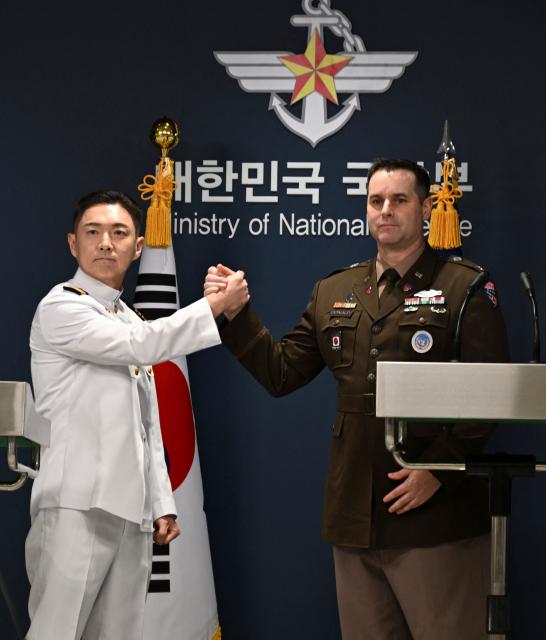 Public Affairs Director of South Korea's Joint Chiefs of Staff Col. Jang Do-young (L) and Public Affairs Director of the United Nations Command, Combined Forces Command, and United States Forces Korea (USFK) Col. Ryan Donaldn (R) attend a press briefing for the Ulchi Freedom Shield 2026 exercise at the Defence Ministry in Seoul on August 10, 2026. (Photo by SONG Kyung-Seok / POOL / AFP)