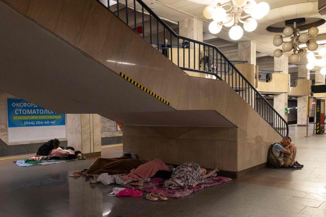 People sleep as they take shelter overnight, in a Kyiv metro station following warnings of a possible Russian air attack, on early August 10, 2026, amid the Russian invasion of Ukraine. By sunrise, no large-scale attack had taken place on the Ukranian capital as warnings continued for the coming days. (Photo by Serhii Okunev / AFP)