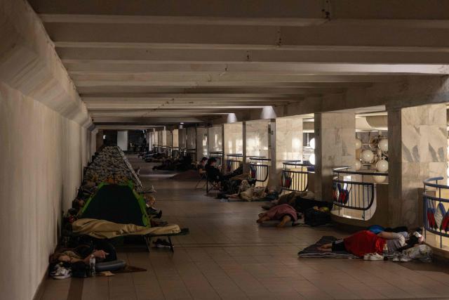 People take shelter overnight, in a Kyiv metro station following warnings of a possible Russian air attack, on early August 10, 2026, amid the Russian invasion of Ukraine. By sunrise, no large-scale attack had taken place on the capital as warnings continued for the coming days. (Photo by Serhii Okunev / AFP)