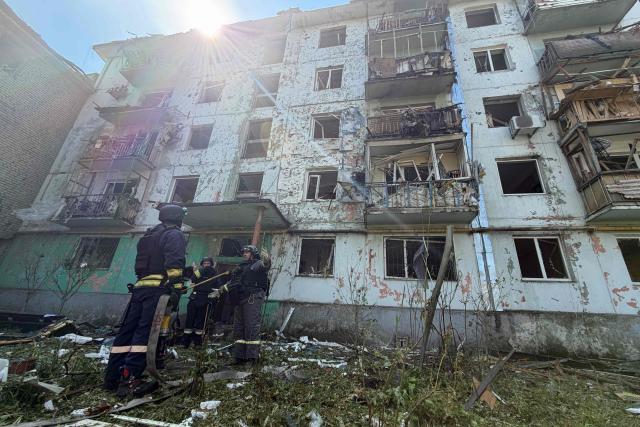 Ukrainian rescuers work at a damaged residential building at the site of a Russian airstrike in Zaporizhzhia on August 10, 2026, amid the Russian invasion of Ukraine. (Photo by Darya NAZAROVA / AFP)