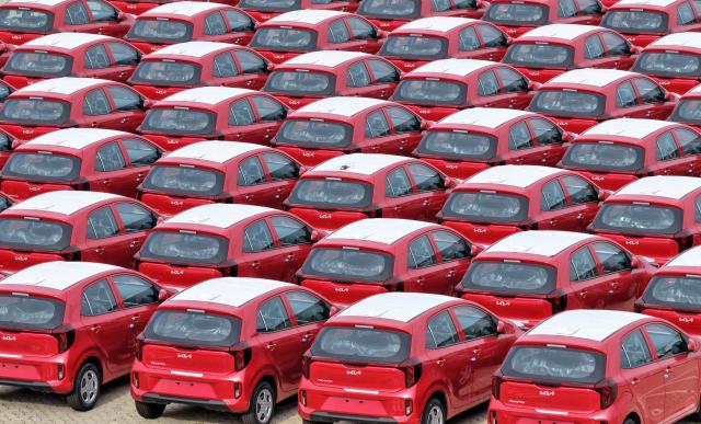 South Korean-made Kia Picanto cars are seen awaiting shipment at a vehicle storage yard in Yantai, in eastern China's Shandong province, on August 10, 2026. (Photo by CN-STR / AFP) / China OUT