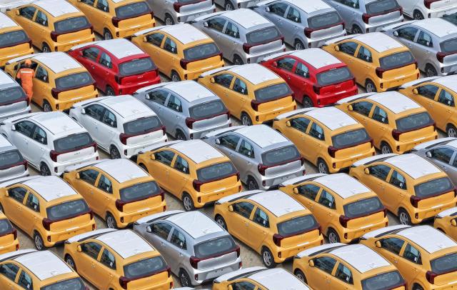 South Korean-made Kia Picanto cars are seen awaiting shipment at a vehicle storage yard in Yantai, in eastern China's Shandong province, on August 10, 2026. (Photo by CN-STR / AFP) / China OUT