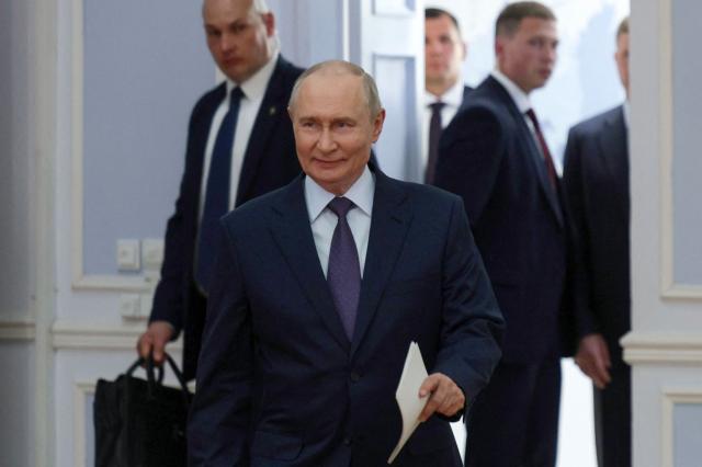 In this pool photograph distributed by the Russian state agency Sputnik, Russia's President Vladimir Putin arrives for a meeting with urban planners in Ulan-Ude on August 10, 2026. (Photo by Gavriil Grigorov / POOL / AFP)