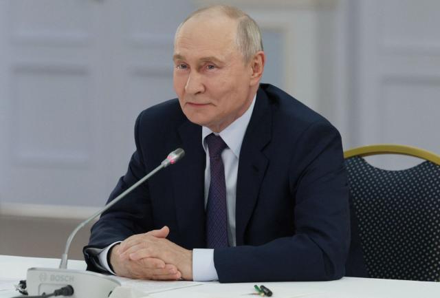 In this pool photograph distributed by the Russian state agency Sputnik, Russia's President Vladimir Putin attends a meeting with urban planners in Ulan-Ude on August 10, 2026. (Photo by Gavriil Grigorov / POOL / AFP)