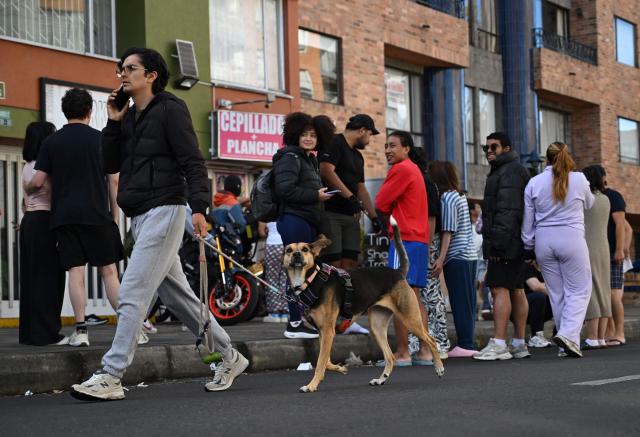 People evacuate after an earthquake in Medellin, Colombia on August 10, 2026. A strong earthquake struck Colombia on August 10 and was strongly felt in major cities such as Bogota and Cali, and even in Quito and Panama, according to the Colombian Geological Service and as confirmed by AFP reporters. (Photo by Raul ARBOLEDA / AFP)