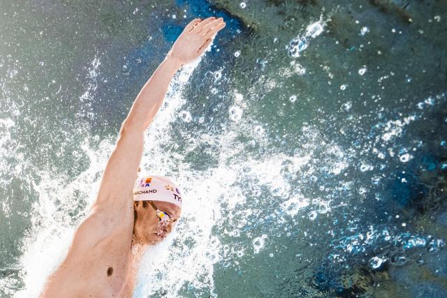 France's swimmer Leon Marchand competes in the men's 4x200m freestyle relay swimming final during the LEN European Aquatics Championships at the Olympic Aquatic Centre in Saint-Denis, northern suburbs of Paris, on August 10, 2026. (Photo by Sébastien BOZON / AFP)