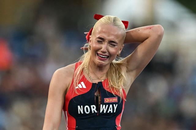 Norway's Lovise Skarbavik Andresen reacts after falling over the last hurdle while competing in the women's 100m hurdles heat 3 during the European Athletics Championships at Alexander Stadium in Birmingham on August 10, 2026. (Photo by Paul ELLIS / AFP)