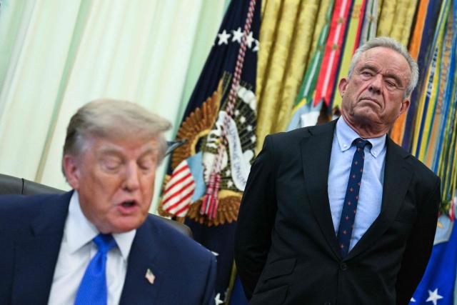 US Secretary of Health and Human Services Robert F. Kennedy Jr. (R) looks on as President Donald Trump speaks before signing an executive order calling for more research and flexibility on vaccines, in the Oval Office of the White House in Washington, DC, on August 10, 2026. (Photo by Jim WATSON / AFP)