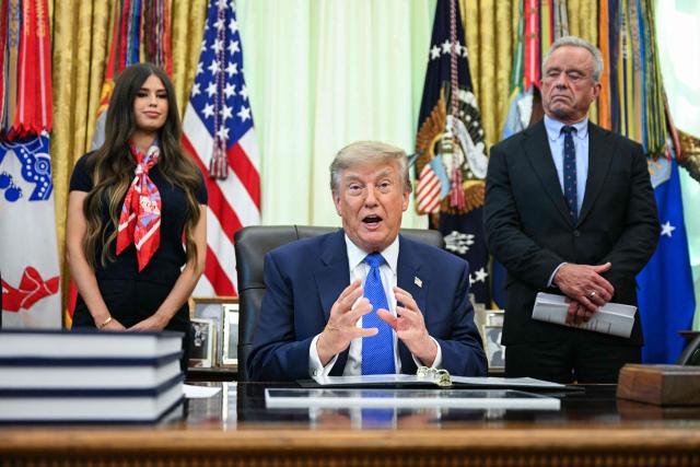 US Secretary of Health and Human Services Robert F. Kennedy Jr. (R) looks on as President Donald Trump speaks before signing an executive order calling for more research and flexibility on vaccines, in the Oval Office of the White House in Washington, DC, on August 10, 2026. (Photo by Jim WATSON / AFP)