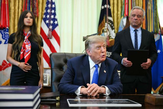 US President Donald Trump speaks after signing an executive order calling for more research and flexibility on vaccines, alongside US Secretary of Health and Human Services Robert F. Kennedy Jr. (R) and Jayme Leagh Franklin (L), founder of The Conservateur, in the Oval Office of the White House in Washington, DC, on August 10, 2026. (Photo by Jim WATSON / AFP)