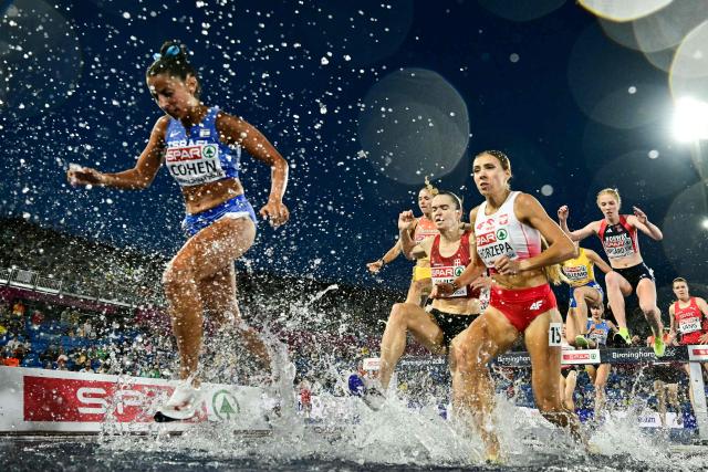 Israel's Adva Cohen (L) competes in the women's 3000m steeplechase heat 1 during the European Athletics Championships at Alexander Stadium in Birmingham on August 10, 2026. (Photo by Ben STANSALL / AFP)
