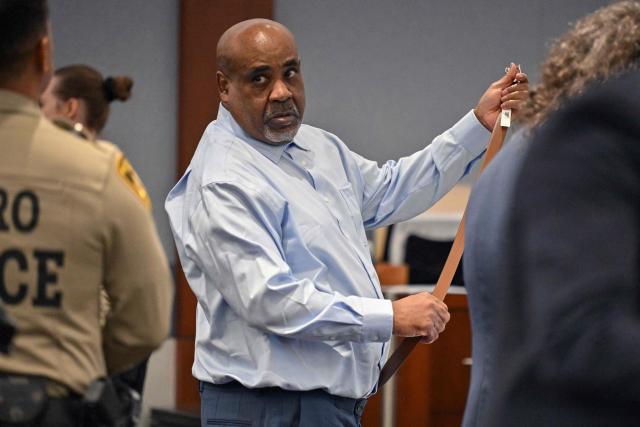 Duane Davis removes his belt before exiting the courtroom for lunch on the first day of jury selection in his murder trial related to the 1996 killing of rapper Tupac Shakur at Clark County District Courts Regional Justice Center in Las Vegas, Nevada, on August 10, 2026. The trial of a former gang leader accused of orchestrating the murder of rapper Tupac Shakur finally began on August 10, 30 years after one of America's most high-profile unresolved killings. The proceedings, expected to last a month, will likely not make clear who fired the shots that killed the California hip-hop legend on the night of September 7, 1996, while he was in Las Vegas to see a Mike Tyson boxing match. (Photo by David Becker / POOL / AFP)