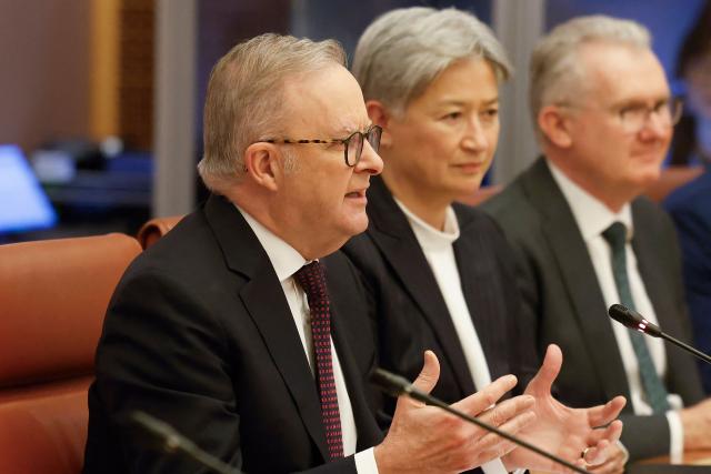 Australian Prime Minister Anthony Albanese (L) and Vietnamese General Secretary and President To Lam (not pictured) hold talks as Australian Foreign Minister Penny Wong (C) looks on at Parliament House in Canberra on August 11, 2026. (Photo by HILARY WARDHAUGH / AFP)