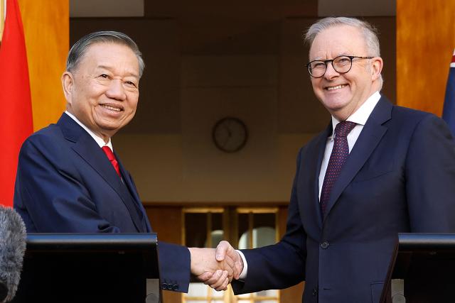 ietnamese General Secretary and President To Lam (L) and Australian Prime Minister Anthony Albanese attend a joint press conference at Parliament House in Canberra on August 11, 2026. To Lam is visiting Australia on a four-day official visit to hold talks on bilateral and international issues. (Photo by hilary wardhaugh / AFP)