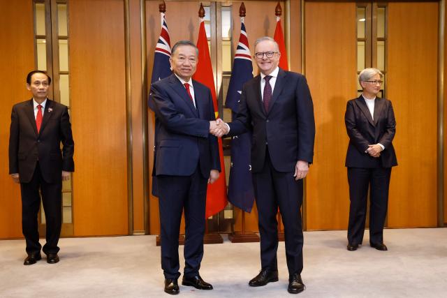 Australian Prime Minister Anthony Albanese (R) and Vietnam General Secretary and President To Lam shake hands after a bilateral meeting at Parliament House in Canberra on August 11, 2026. (Photo by hilary wardhaugh / AFP)