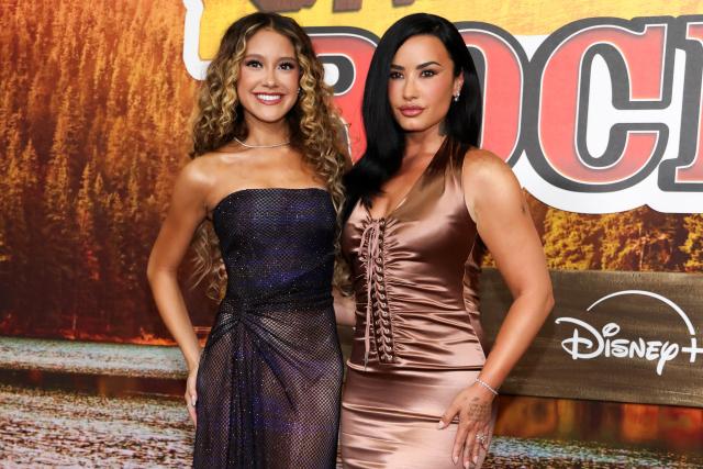 US actress, singer and songwriter Demi Lovato (R) and US singer/actress Liamani Segura attend Disney's "Camp Rock 3" premiere at The Walt Disney Studio Lot in Burbank, California, on August 10, 2026. (Photo by VALERIE MACON / AFP)