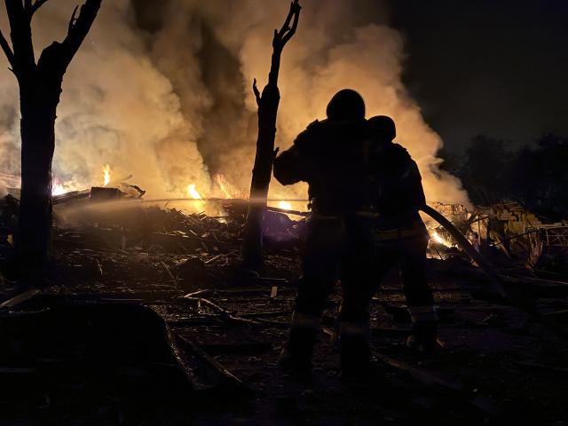 Ukrainian rescuers work at the site of a Russian strike in Zaporizhzhia on August 11, 2026, amid the Russian invasion of Ukraine. (Photo by Darya NAZAROVA / AFP)